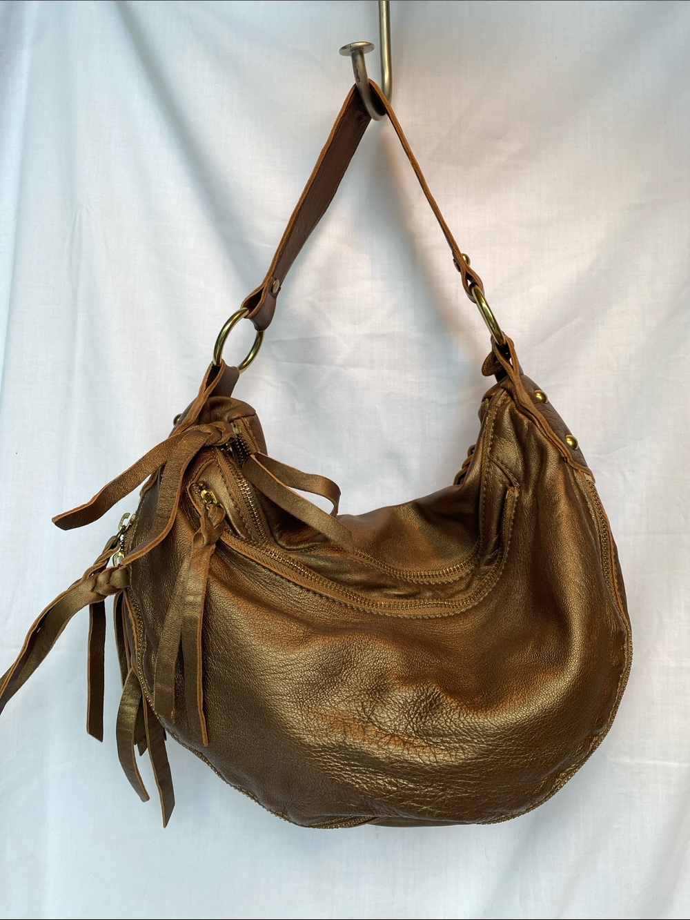 Abro Bronze Leather Hobo Bag with Tassel Detail and seqin accent